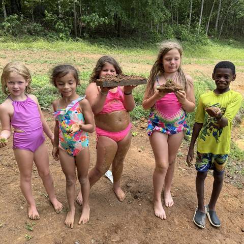 Campers posing in swimsuits