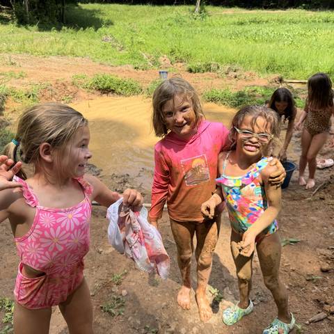 Campers playing in the mud