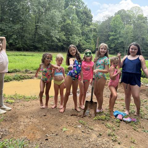 Campers in swimsuits on the field