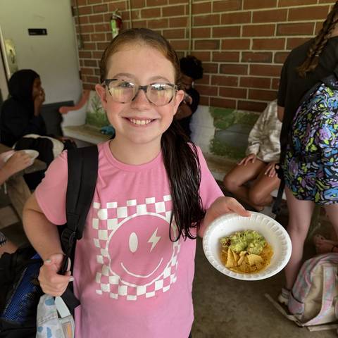 Camper with a bowl of food