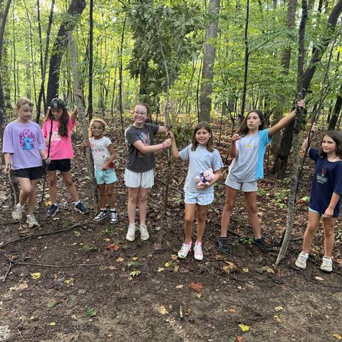 Campers posing in the woods