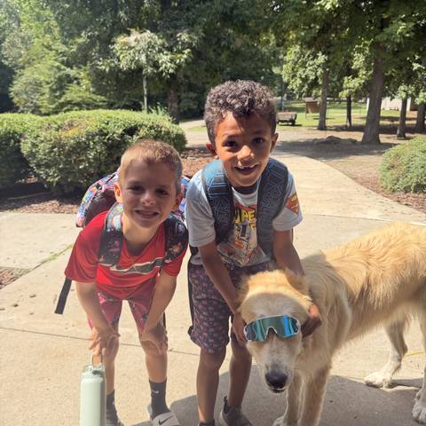 Campers with a golden retriever