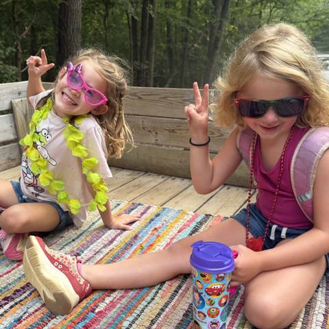 Campers relaxing on a blanket