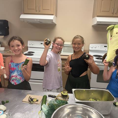 Campers cooking in the kitchen
