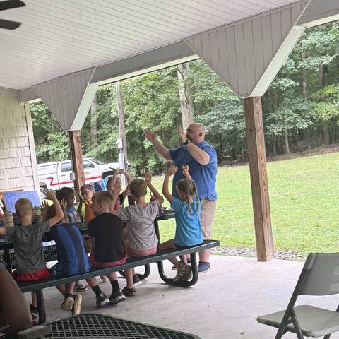 Campers under the covered pavilion