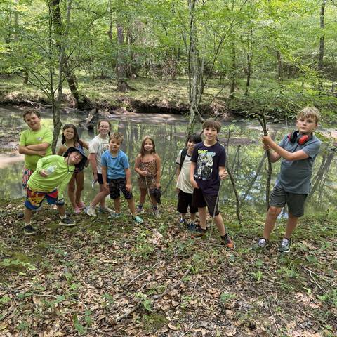 Campers exploring the creek