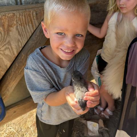 Camper holding a frog