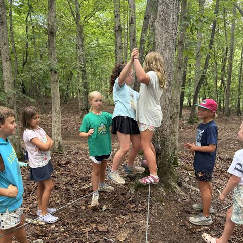 Campers playing in the woods